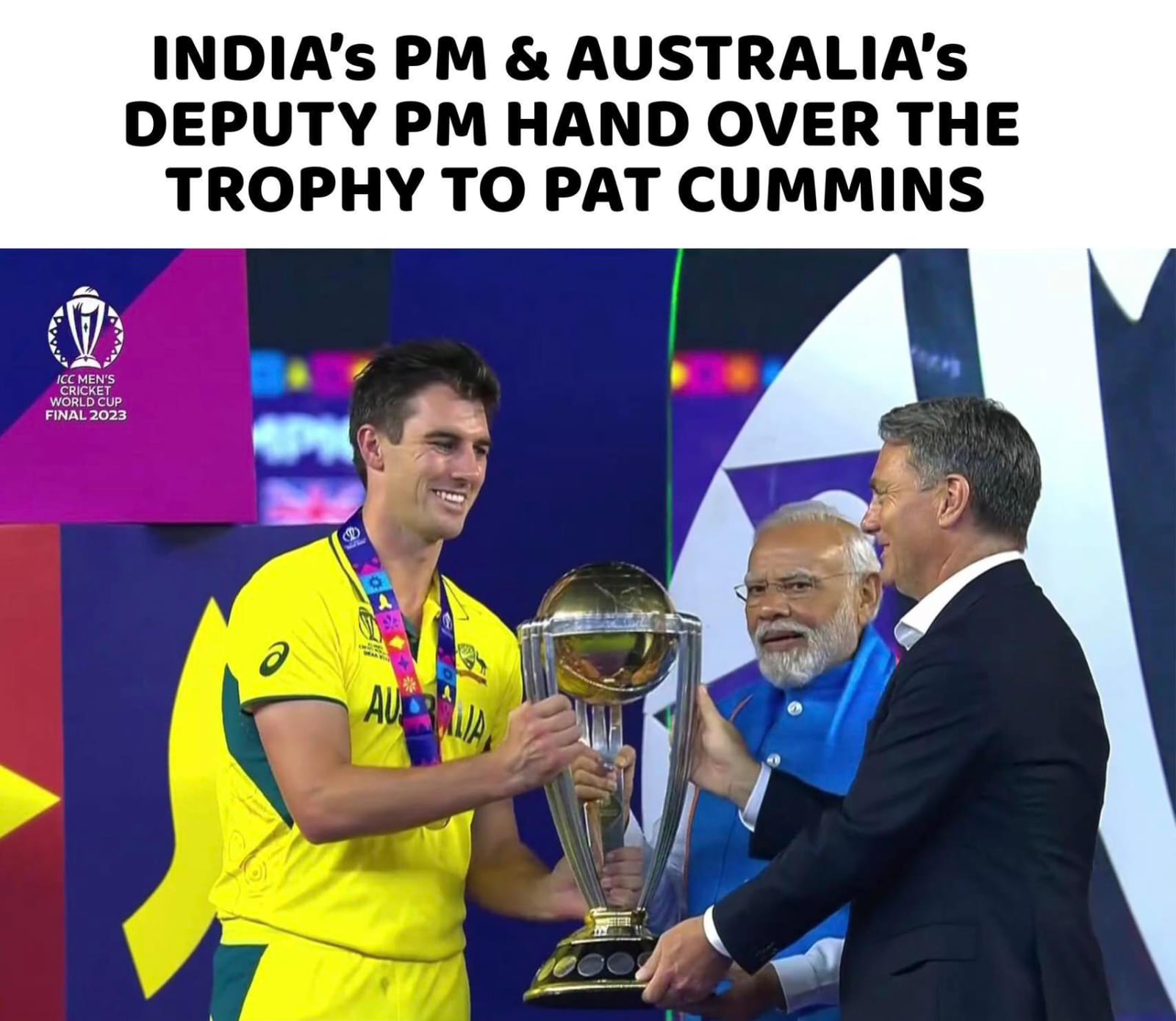 image of Indian PM Modi and Australia deputy PM presenting trophy to Australia captain Cummins